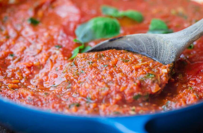 Stir in the tomato sauce, spinach, basil, and oregano