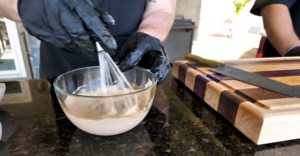 In a small bowl, mix together olive oil, Worcestershire sauce, garlic, and dried oregano