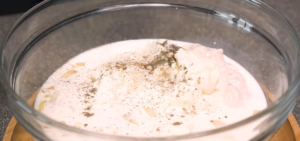 In a large bowl, whisk together beef broth, heavy cream, tomato paste, thyme, salt, and pepper.