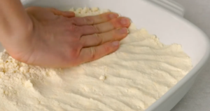 In a mixing bowl, combine the graham cracker crumbs, melted butter, and sugar. Press the mixture firmly into the bottom of a 9x13-inch baking dish to form the crust. Bake for 8-10 minutes, then let it cool completely.